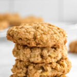 stack of four apple oatmeal cookies with text overlay that reads apple oatmeal cookies