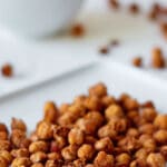 white plate with pumpkin spice roasted chickpeas and text overlay that ready pumpkin spice roasted chickpeas