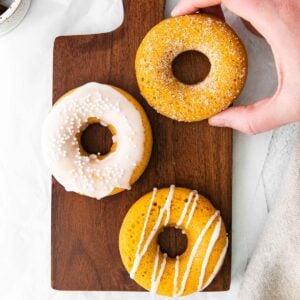 three vanilla glazed pumpkin donuts