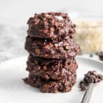 closeup of a stack of four chocolate oat drop cookies