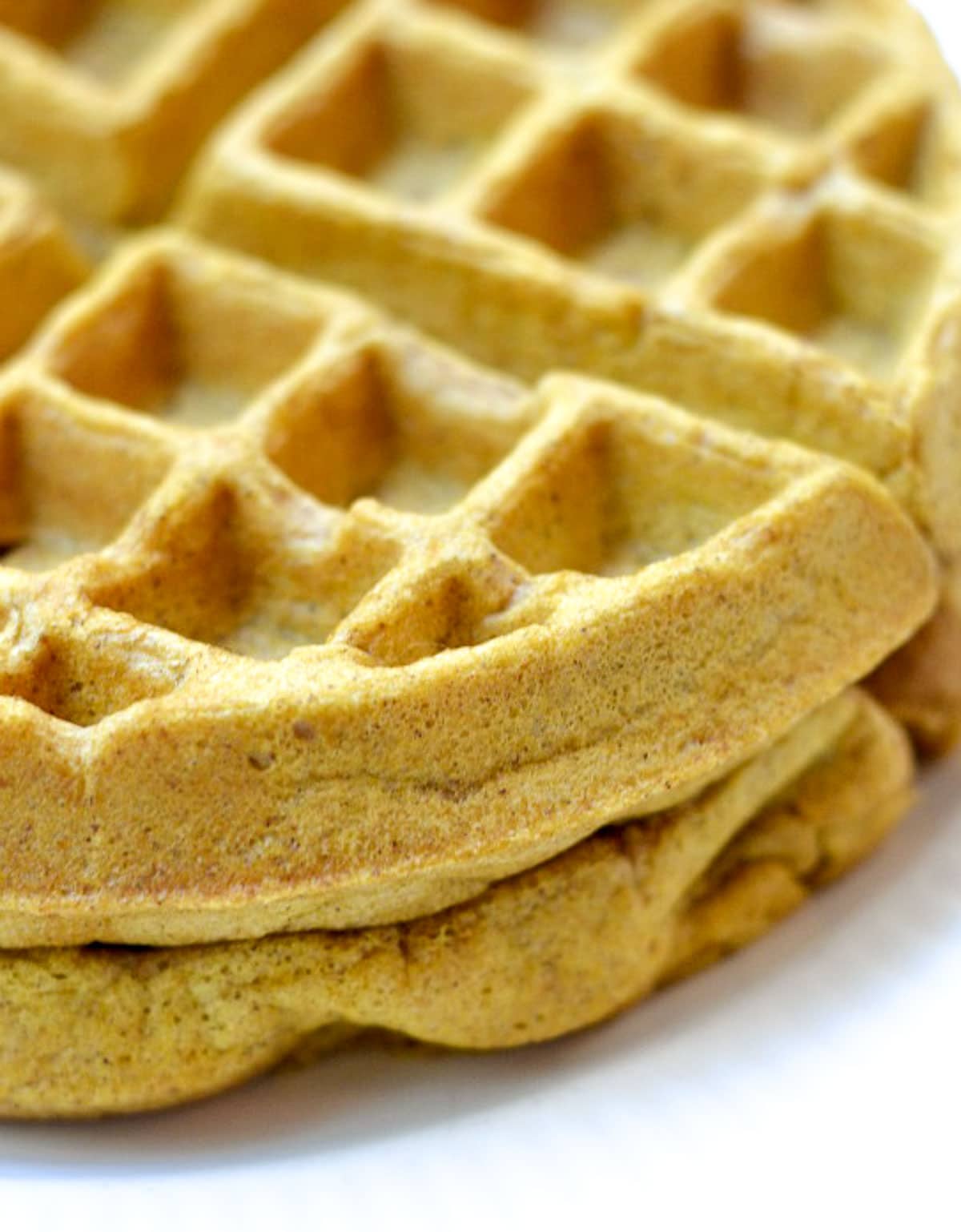 closeup of a stack of two pumpkin waffles