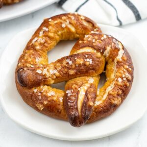 big soft pretzel on a white plate