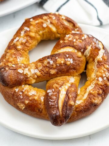 big soft pretzel on a white plate
