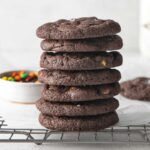 stack of several chocolate cookies on wire rack