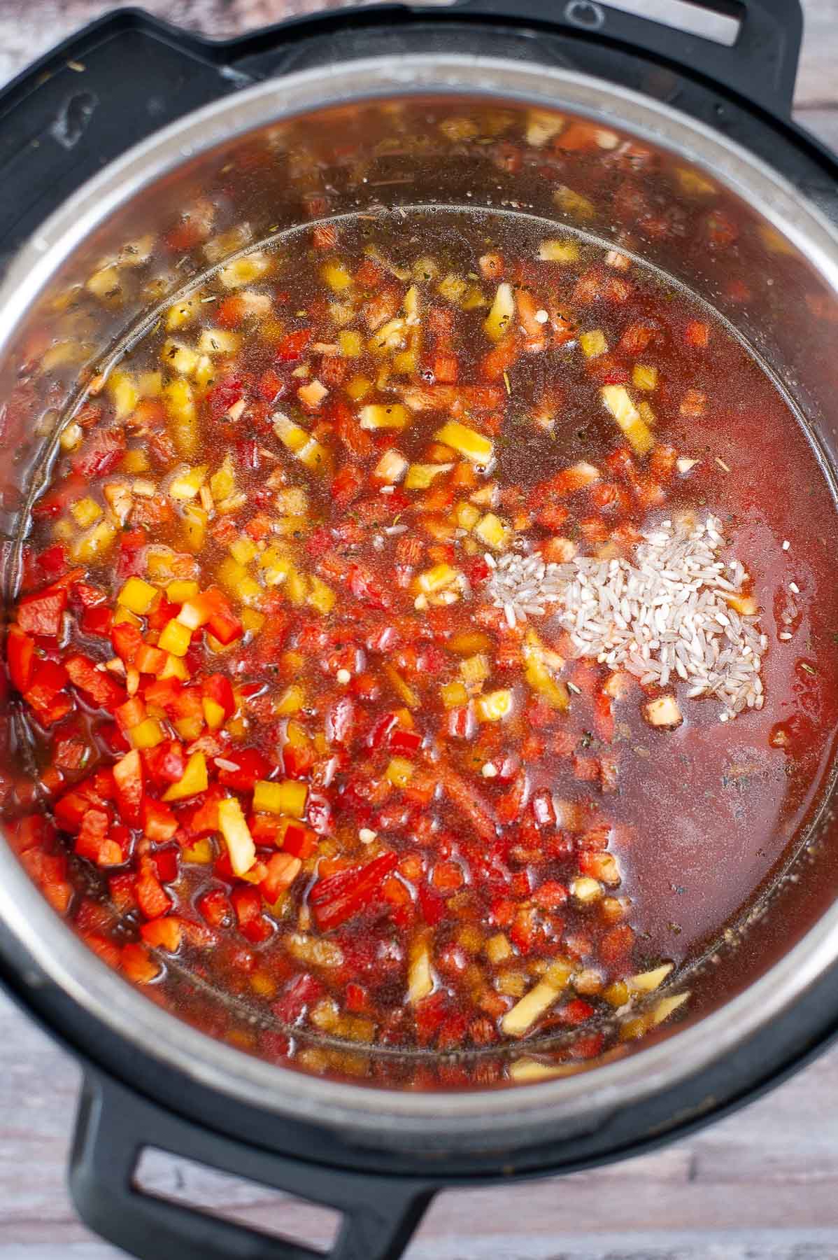 diced red peppers, broth, tomato sauce and rice in an instant pot