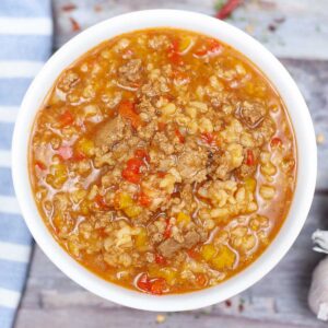 white bowl with stuffed pepper soup with rice and ground turkey