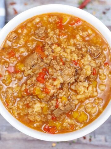 white bowl with stuffed pepper soup with rice and ground turkey