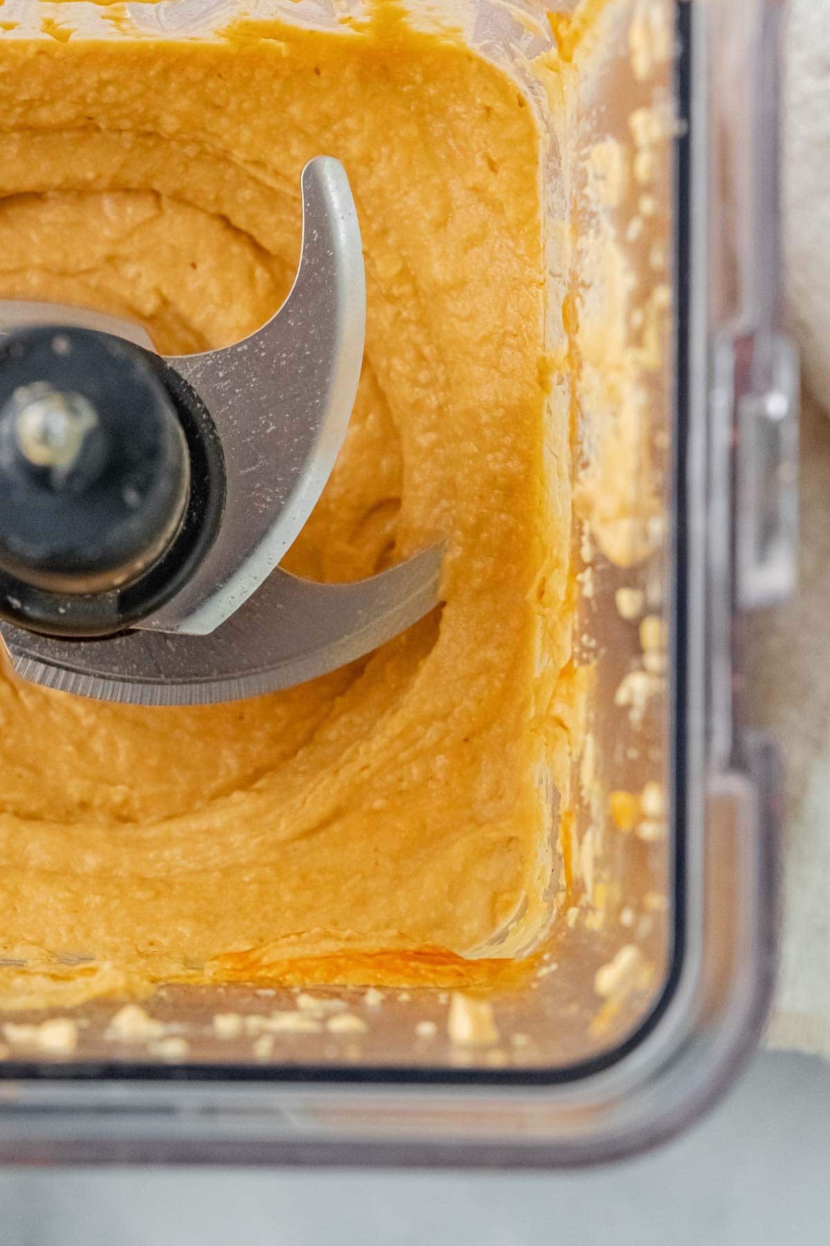 closeup of hummus blended in a blender