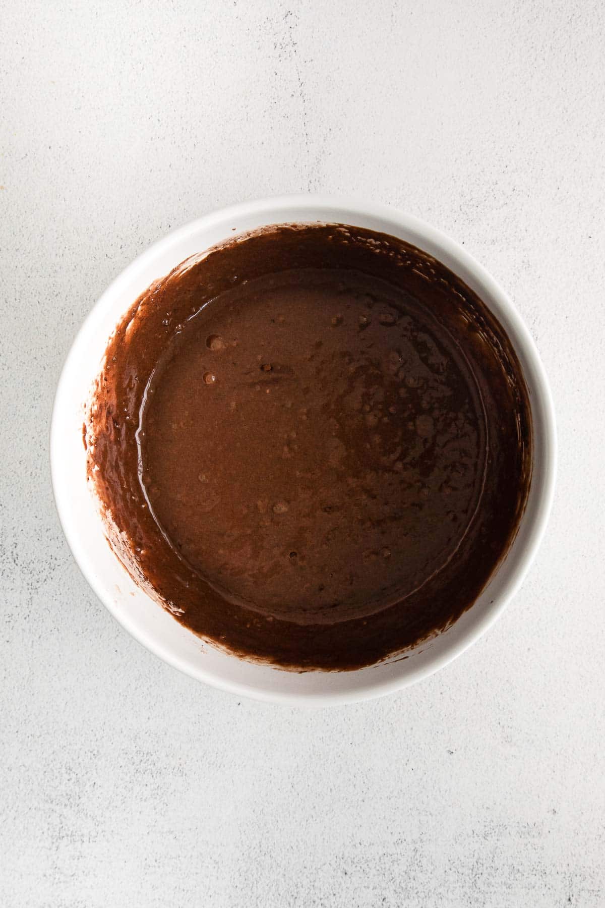 chocolate batter in a white mixing bowl
