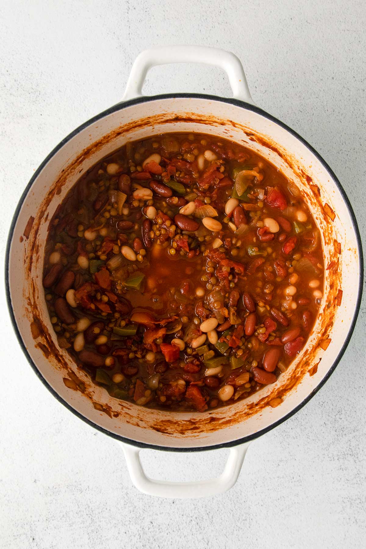 lentil chili in a white dutch oven
