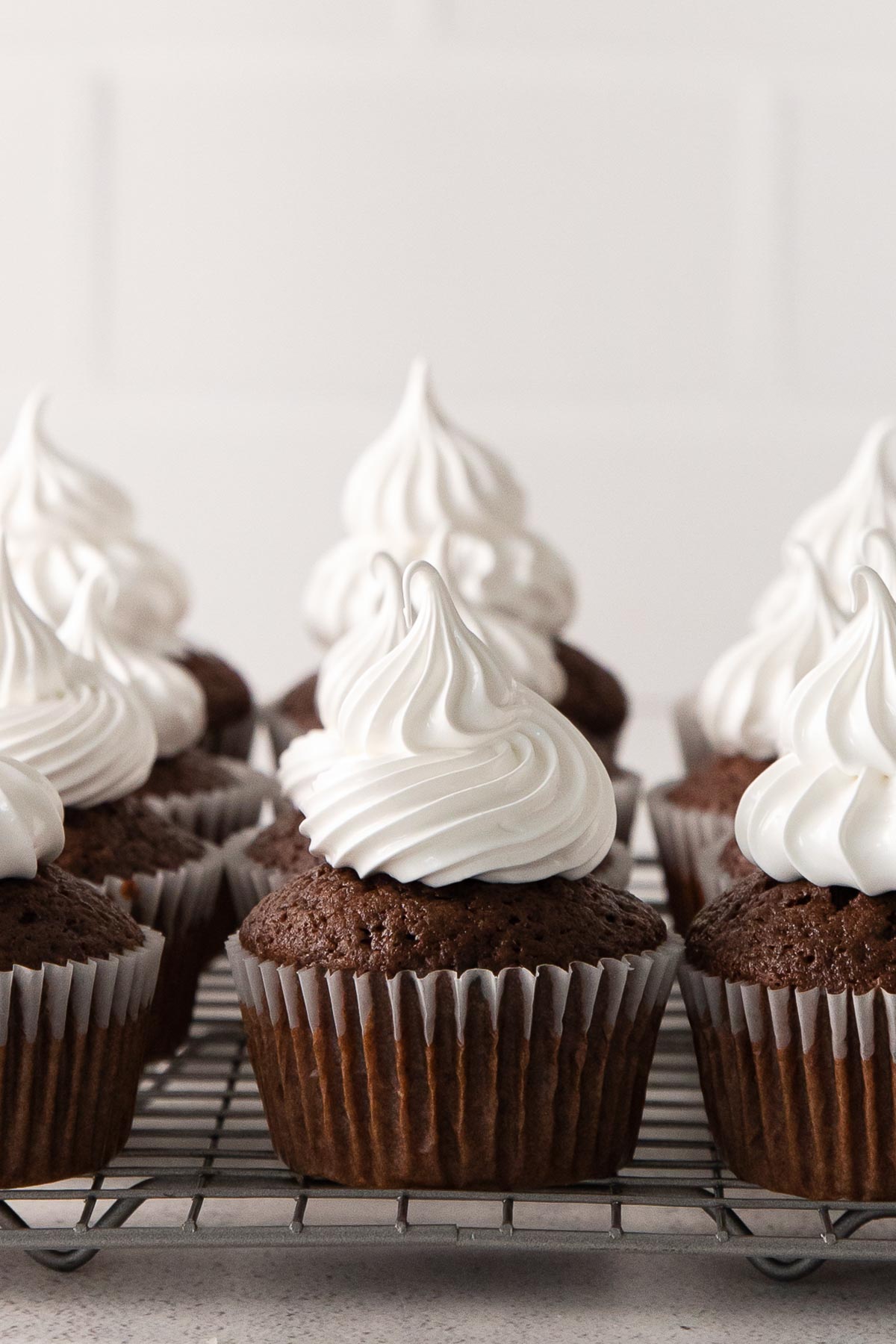 closeup of chocolate cupcake topped with marshmallow icing