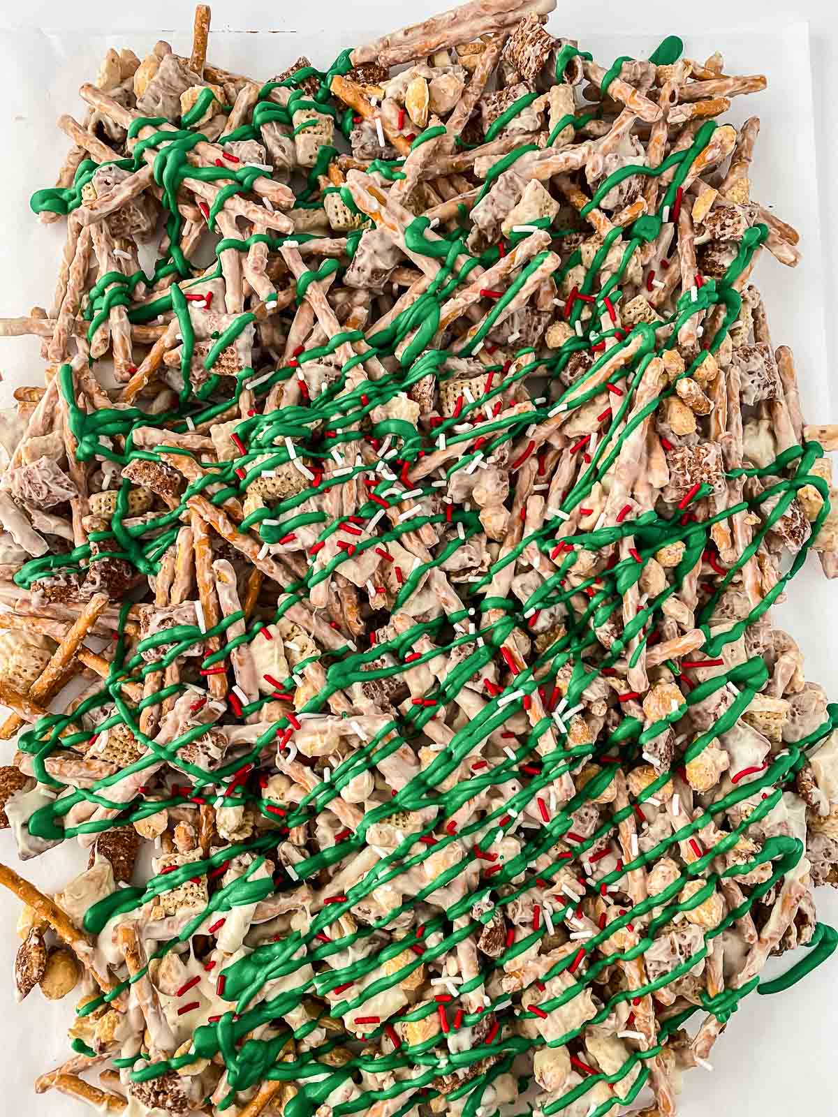 chex cereal mix with white chocolate drizzled with green icing