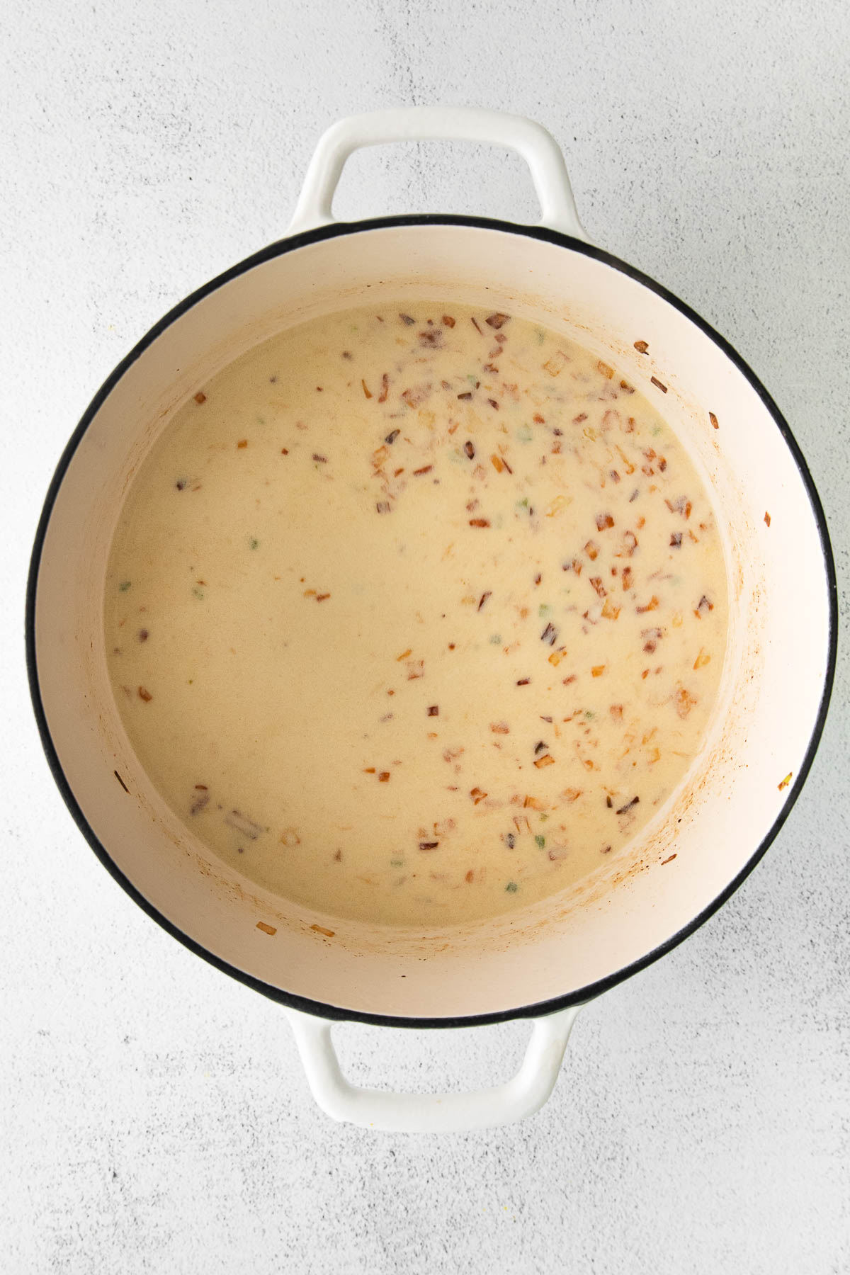 white soup pot with creamy soup