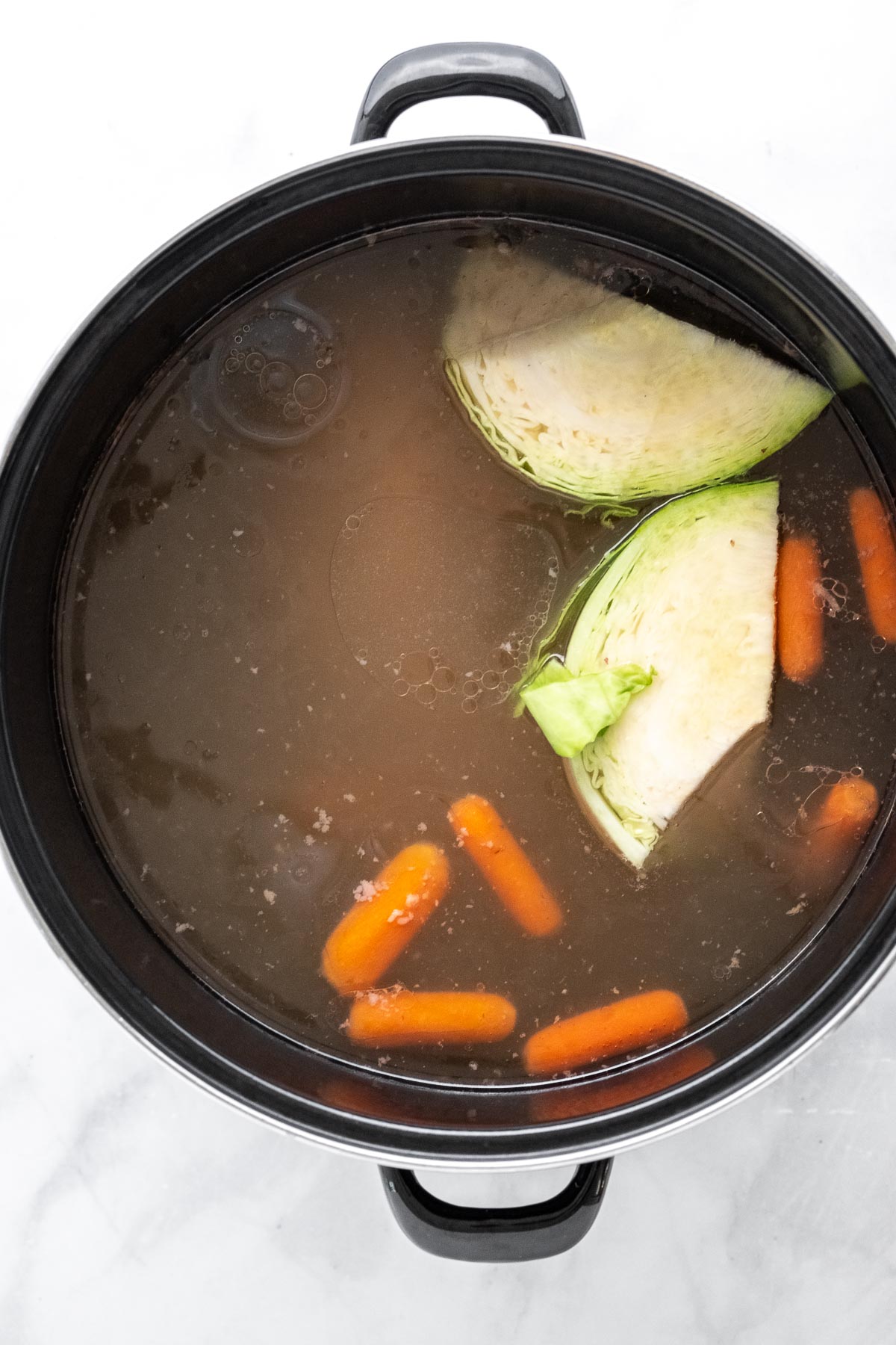 big soup pot with cabbage and carrots