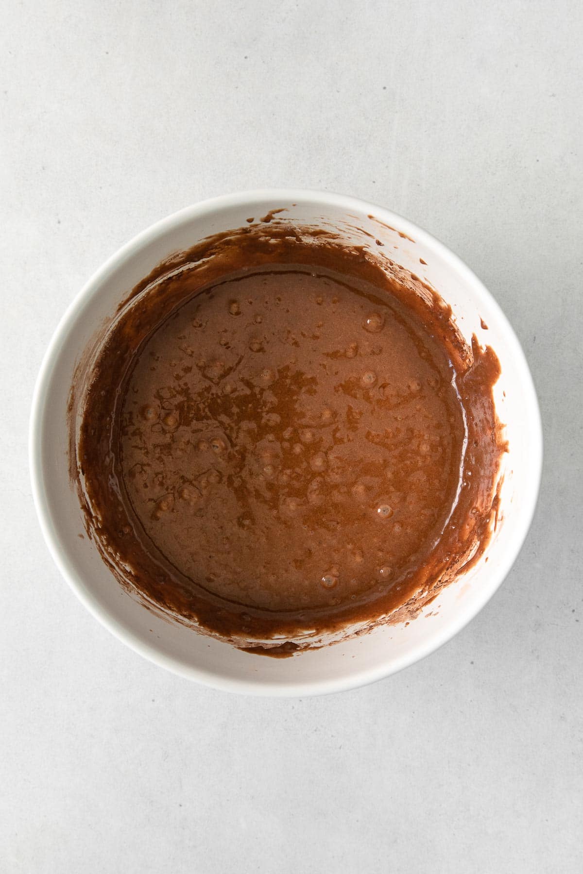 white bowl with chocolate batter