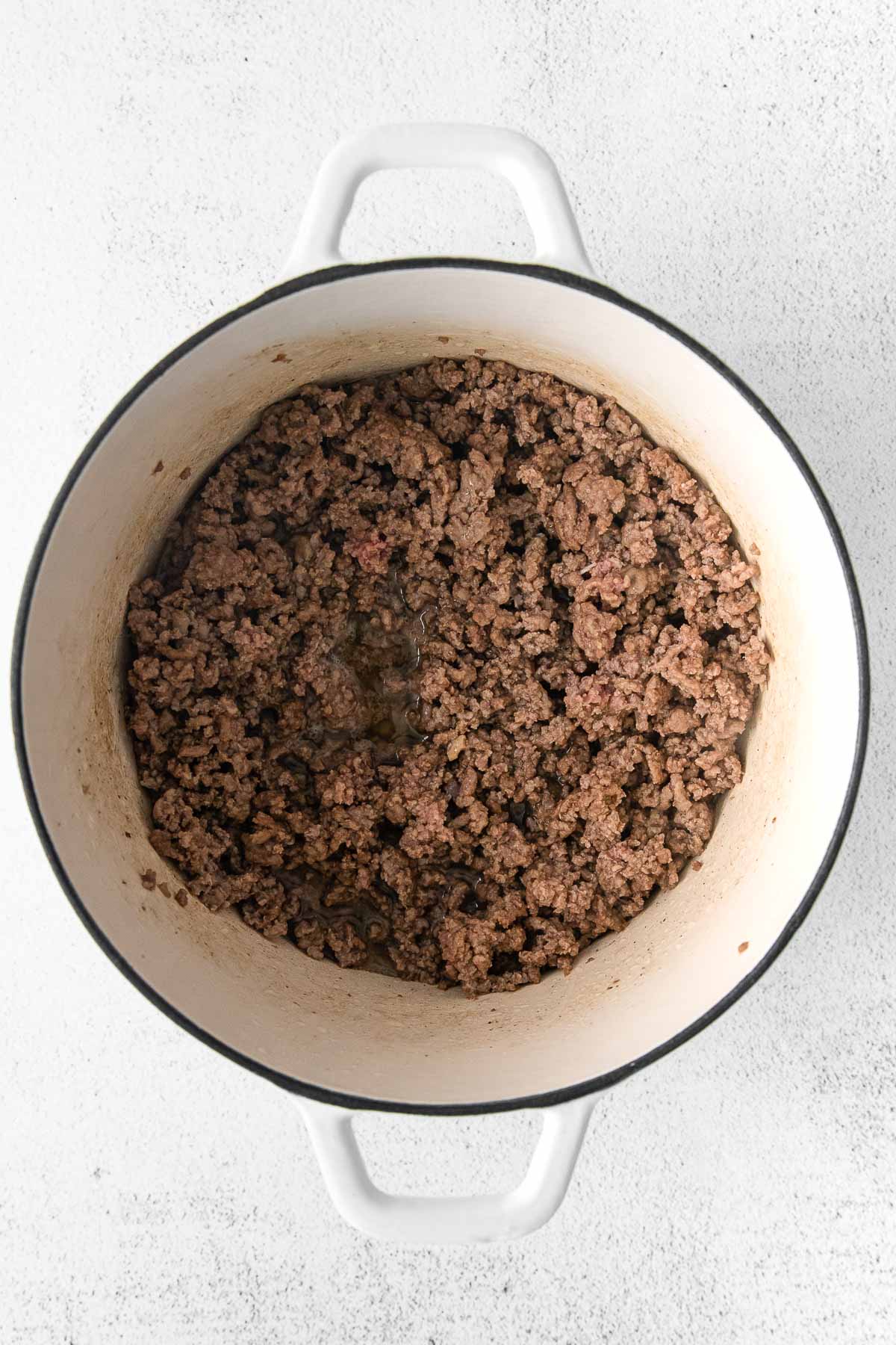 ground beef browned in a white pot