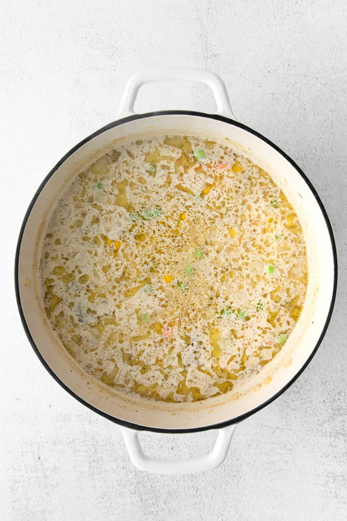 soup broth with peas and corn