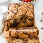 loaf of chocolate chip zucchini bread with two slices cut off