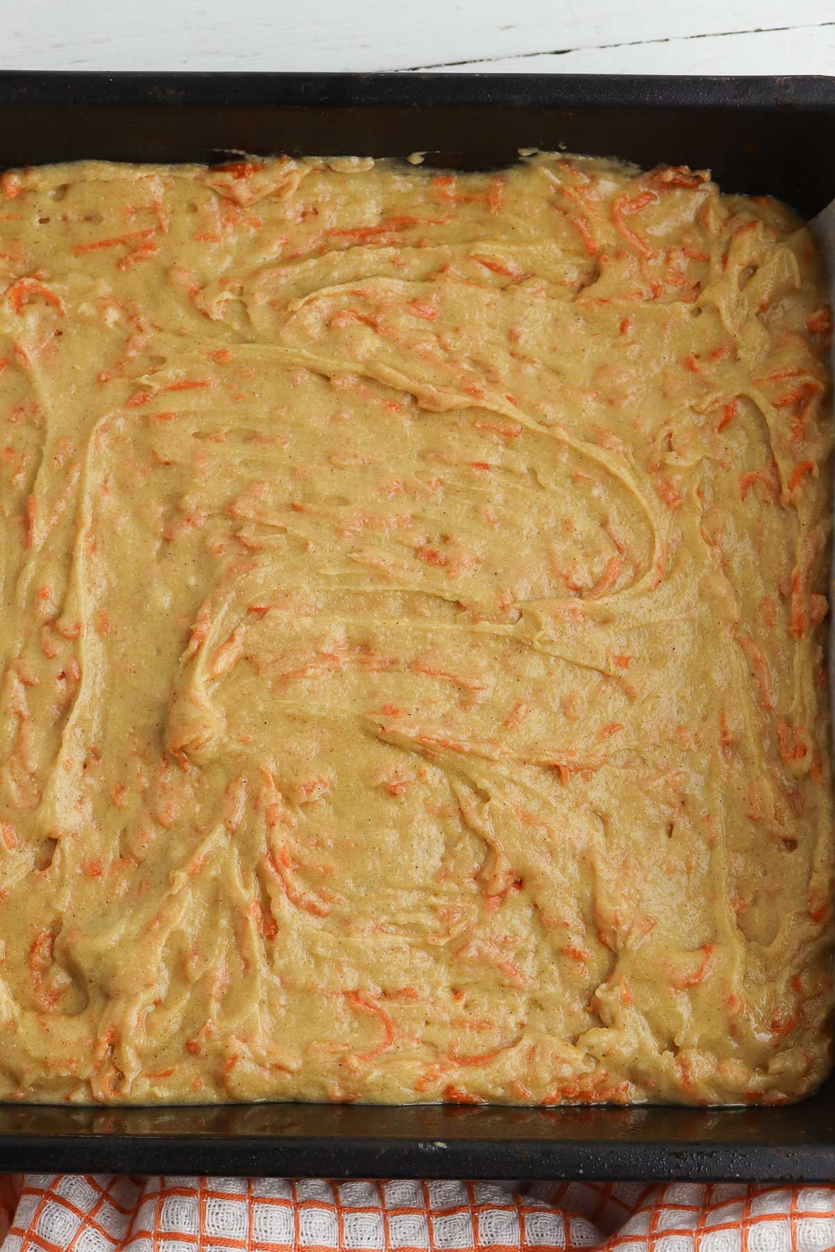 carrot cake batter in a square baking dish