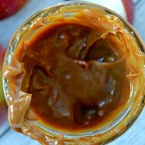 closeup top view of caramel sauce in a jar