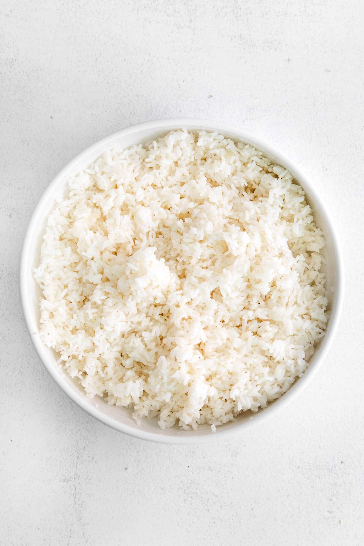 closeup of a white bowl with white rice
