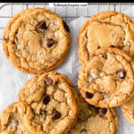 several cookies with mini marshmallows and chocolate chips on a wire rack