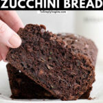 slice of chocolate zucchini bread being picked up by a woman's fingers