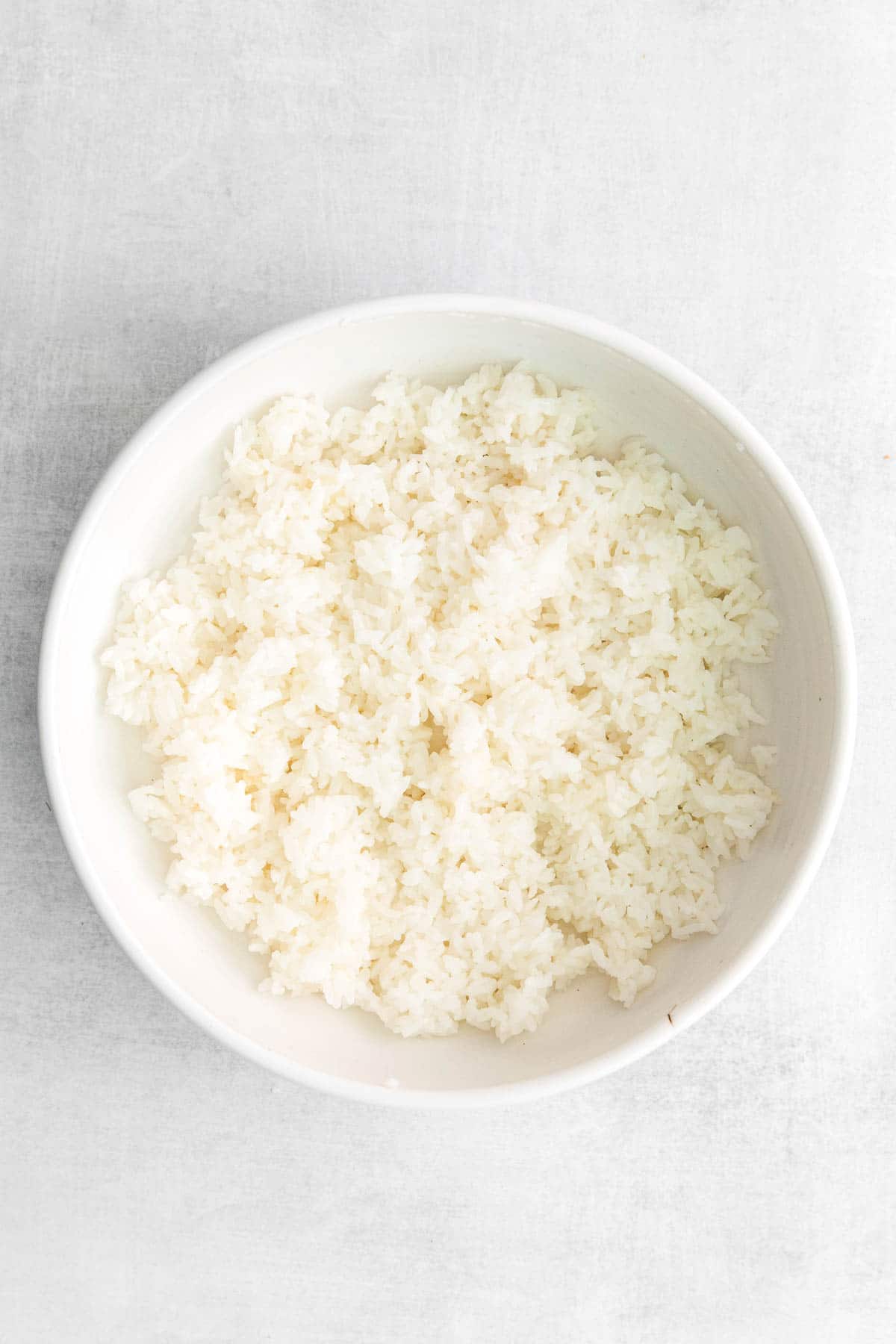 white rice in a white serving bowl