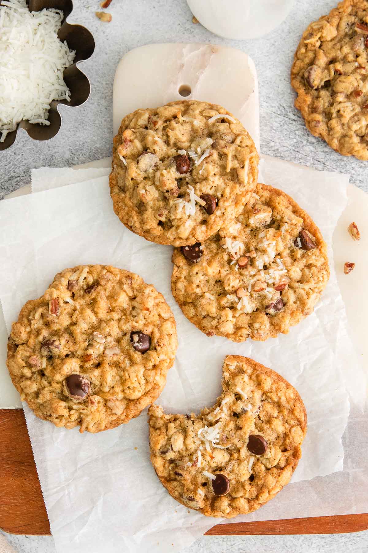 five cowboy cookies with chocolate chips, oats, pecans and shredded coconut.