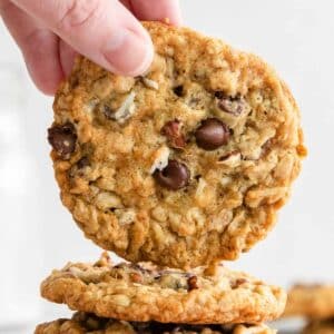 closeup of an oatmeal cookie with chocolate chips, pecans and coconut.