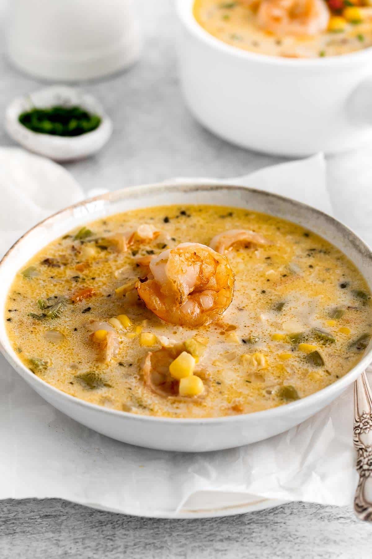 white bowl with shrimp and corn chowder
