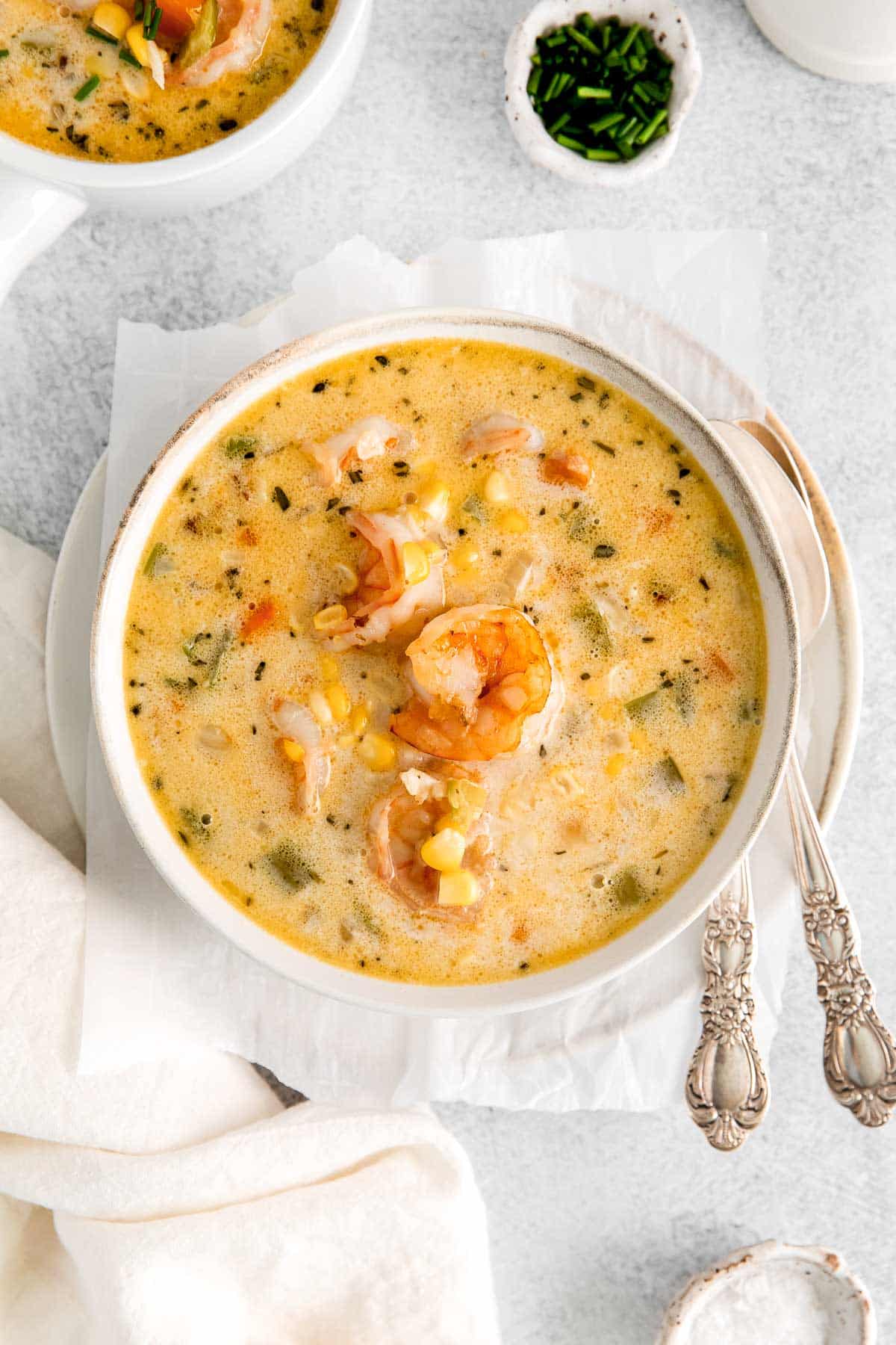 white bowl with corn chowder with shrimp