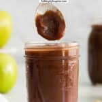 mason jar with homemade apple butter with a spoonful over top