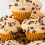 several chocolate chip mini muffins stacked on a white plate.