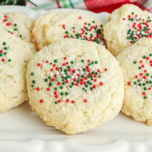 closeup of cream cheese cookies with red white and green sprinkles.