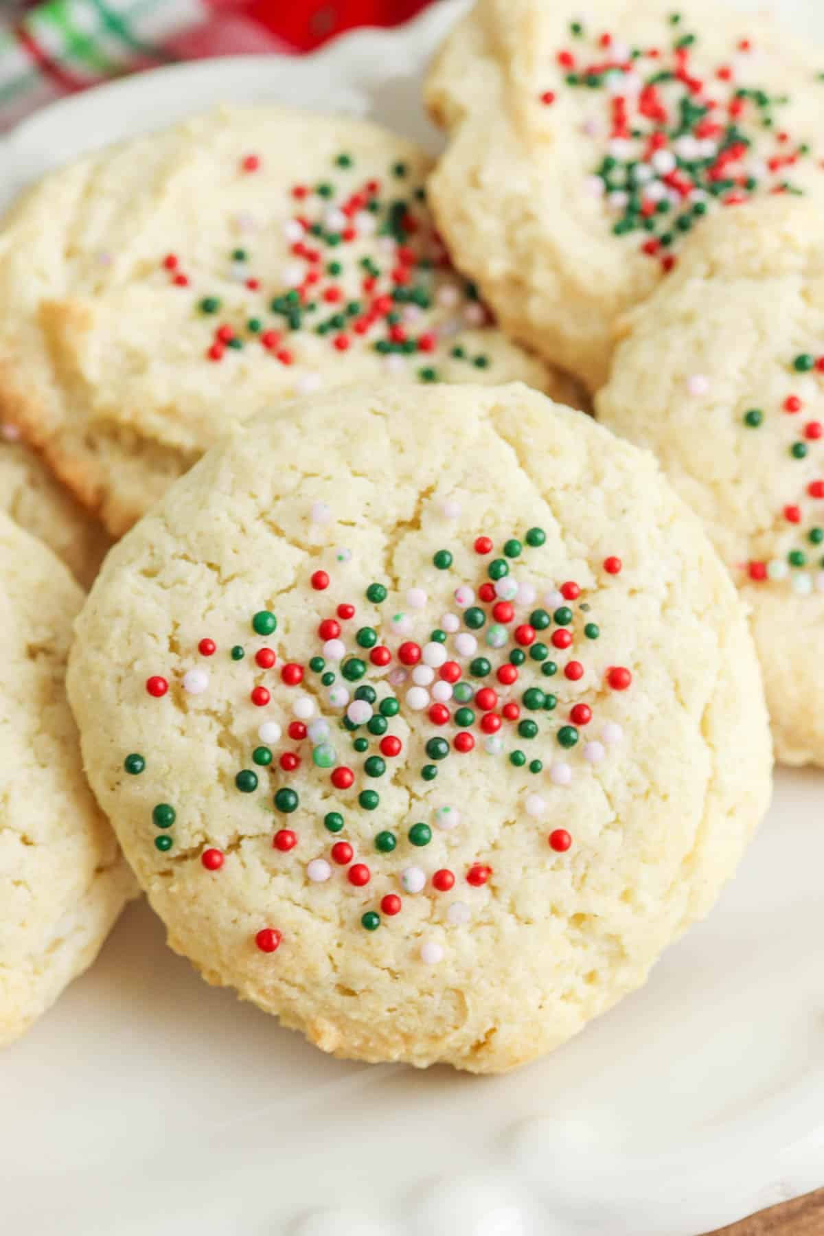 closeup of a vanilla cookie with red green and white Holiday sprinkles.