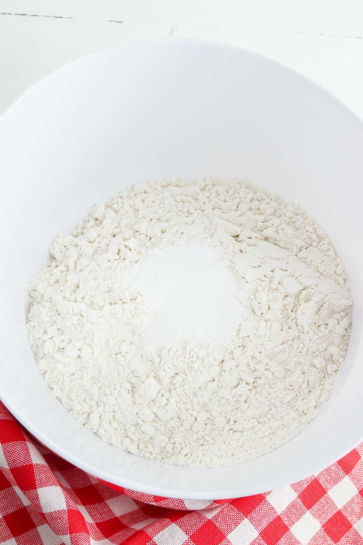 white mixing bowl with flour.