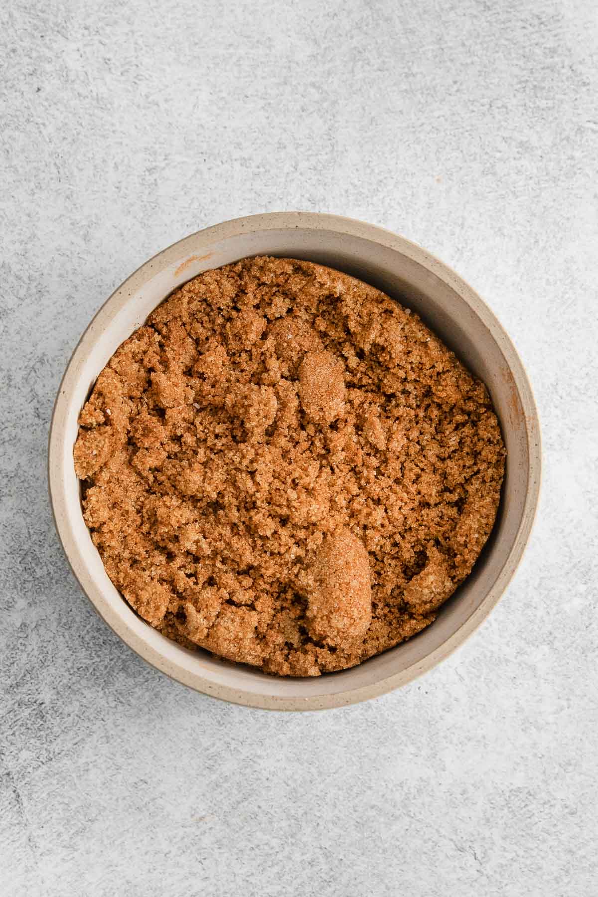 cinnamon sugar mixture in a small tan bowl.
