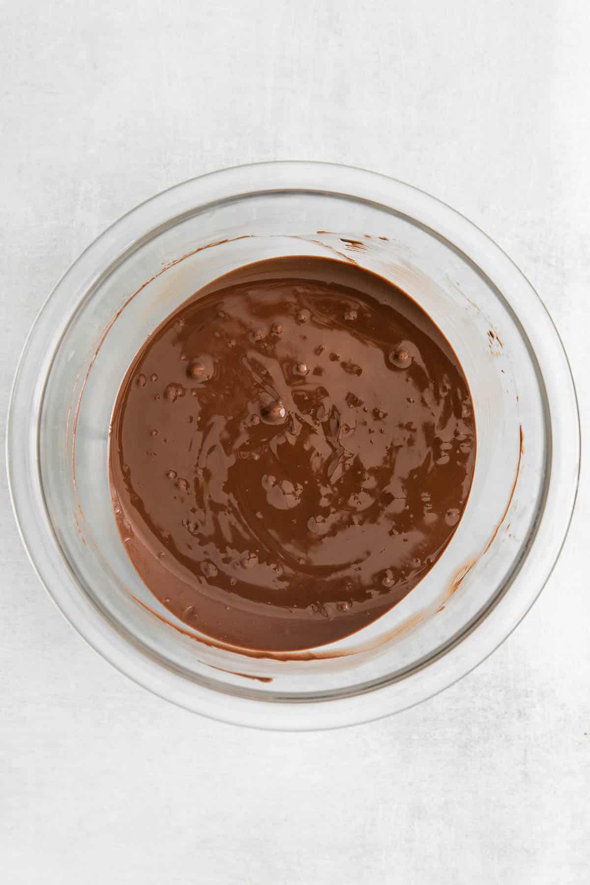 glass mixing bowl with melted chocolate.