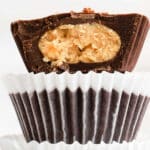 stack of three chocolate peanut butter cups withe the top one cut in half.