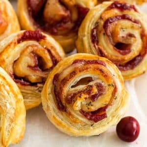 several cranberry brie bites in puff pastry.
