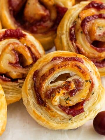 several cranberry brie bites in puff pastry.