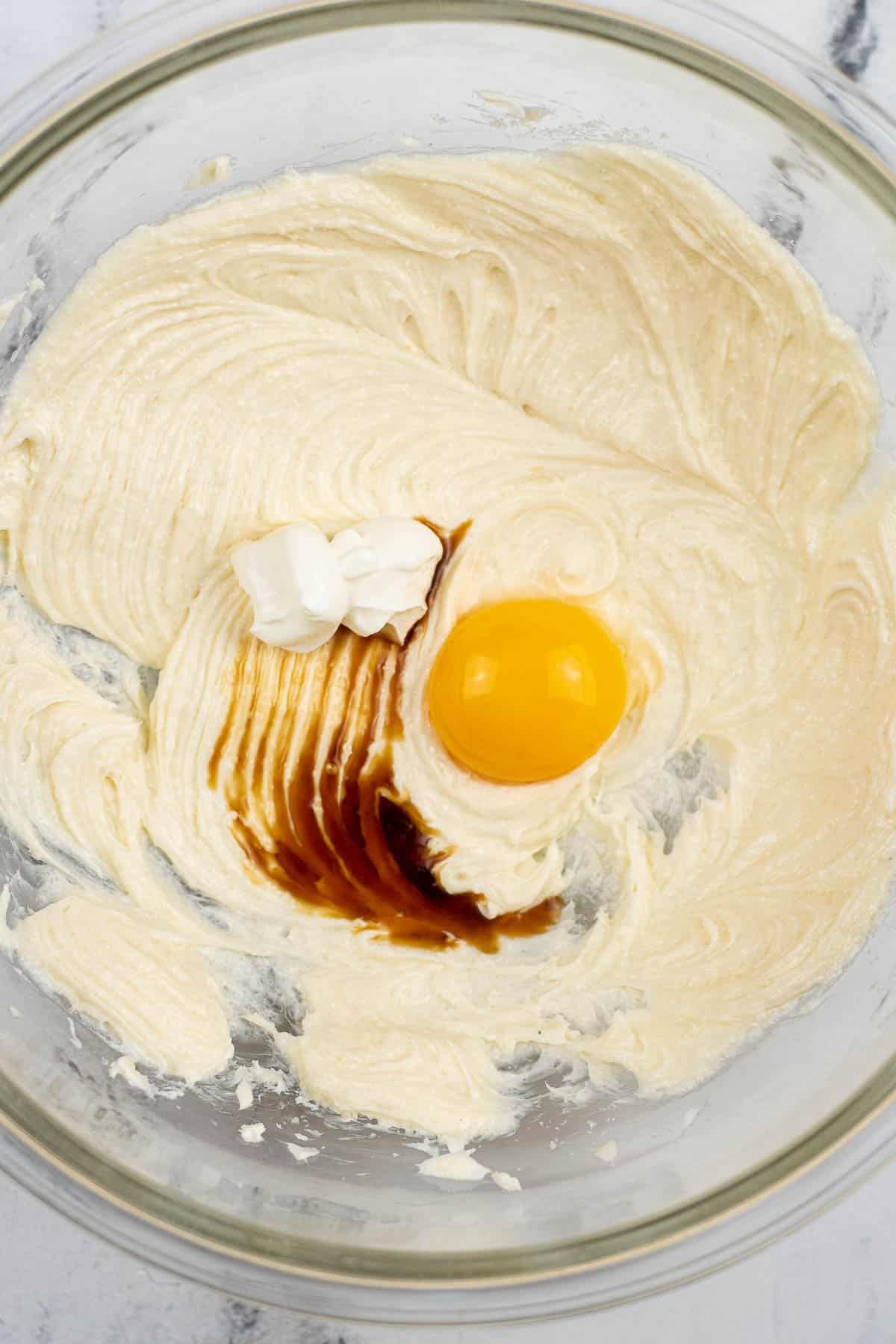 cream cheese and sugar mixture with an egg yolk on top.