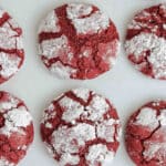 nine red velvet crinkle cookies on a white counter.