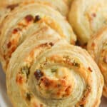 closeup of Jalapeño Popper Pinwheels on a white plate.