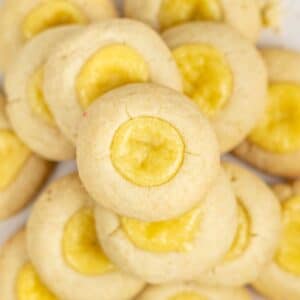 closeup of several cheesecake cookies stacked on top of each other.