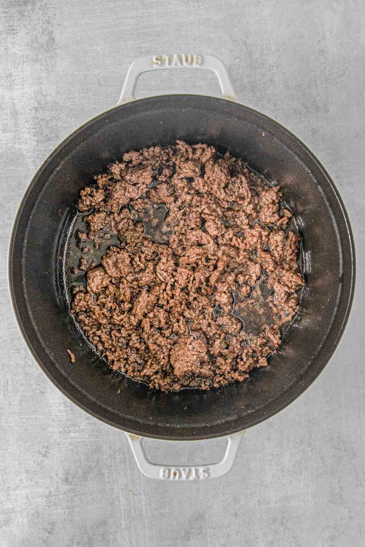 hamburger meat browned and crumbled in a cast iron skillet.