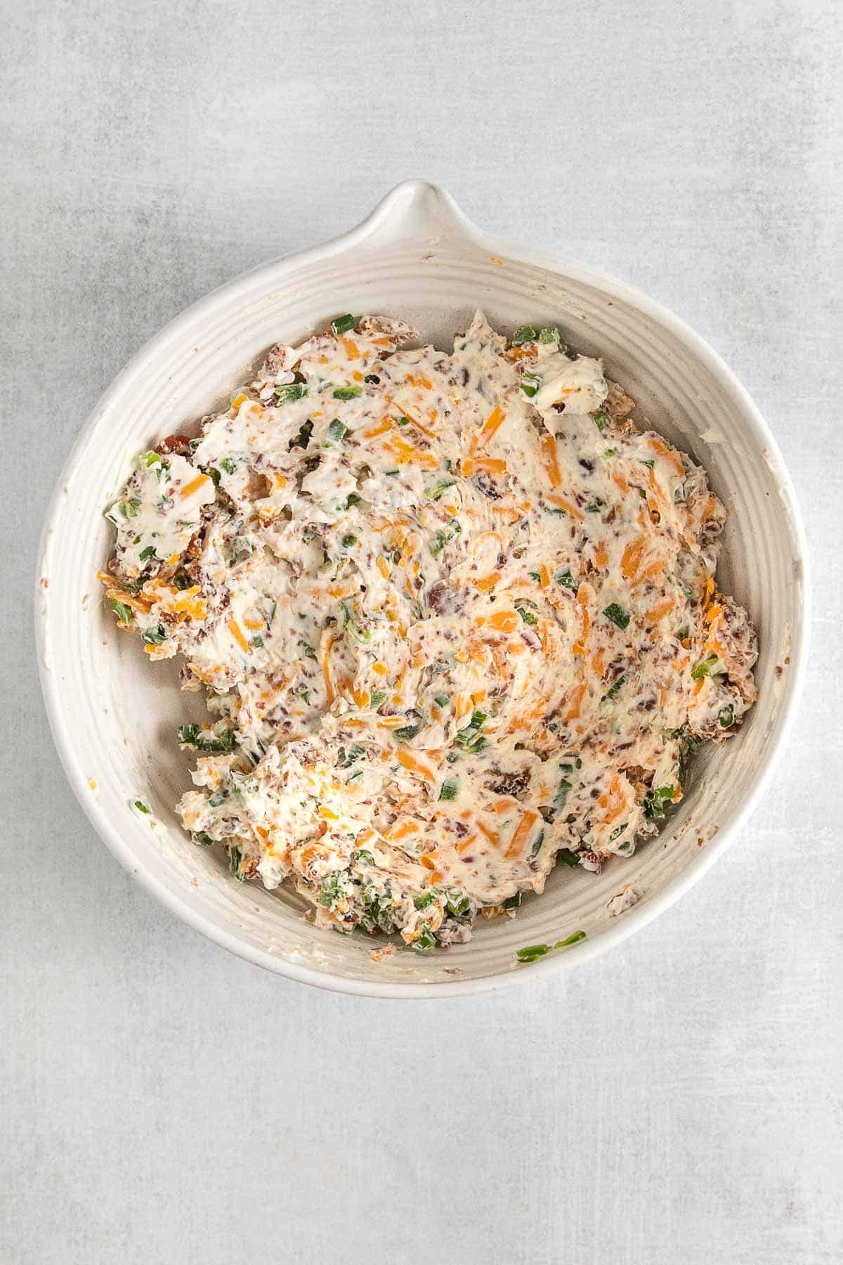 jalapeno popper mixture in a white bowl.