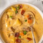 white bowl of cheeseburger soup with bacon and potatoes
