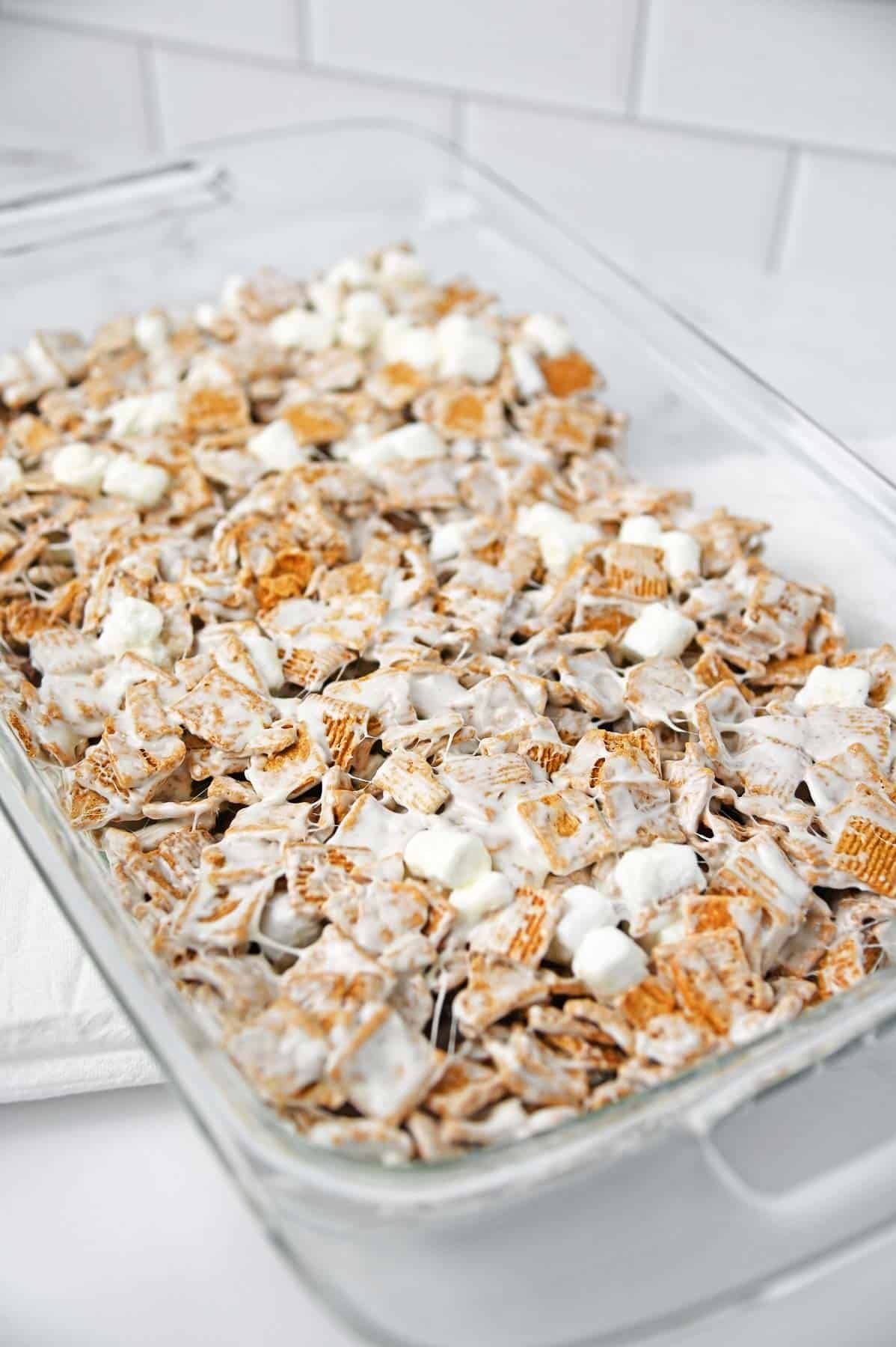 The cereal marshmallow mixture pressed evenly as an additional layer on top of the bottom layer.